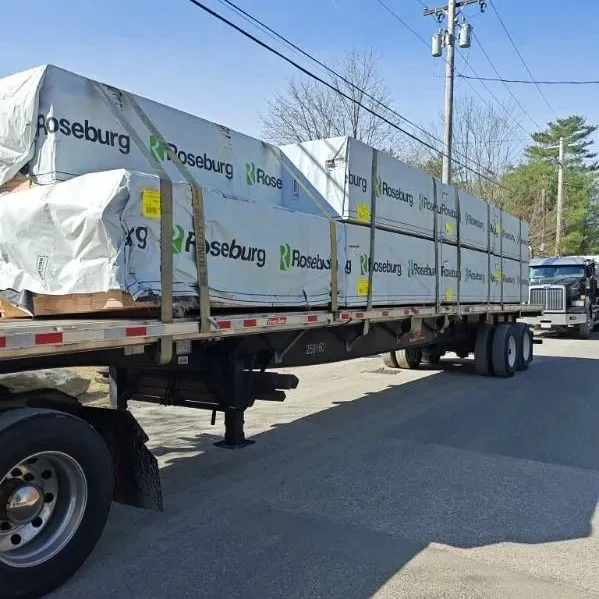 Flatbed loaded with wrapped lumber